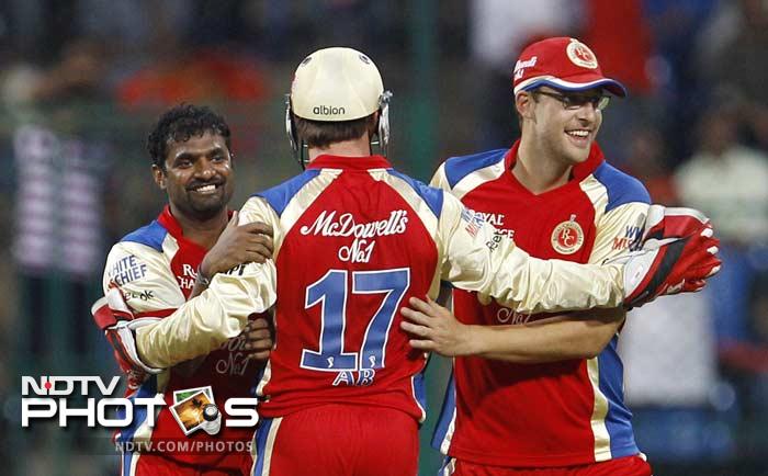 It was Muttiah Muralidaran who brought Bangalore back into the game as he claimed the wickets of Ojha, Finch and Glenn Maxwell in quick succession. (AP Photo/Aijaz Rahi) IPL 5: Bangalore ease past Delhi