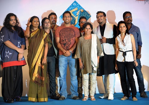 Mahendra Singh Dhoni poses with designers during the announcement of the details of the city's second Fashion Week in Kolkata. (AFP Photo) Dhoni's fashion statement