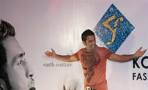 Mahendra Singh Dhoni poses for photographers during an event to announce the dates for the Kolkata Fashion Week in Kolkata. (AP Photo) Dhoni's fashion statement