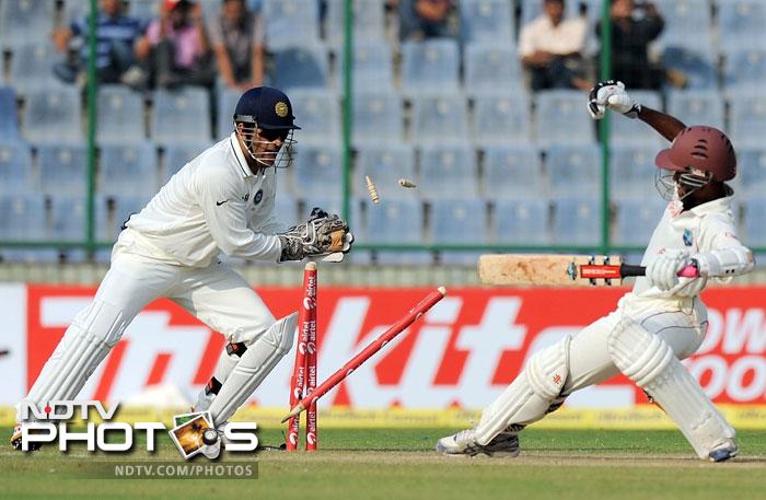 MS Dhoni on Sunday reached another milestone as he pipped Syed Kirmani to become the Indian wicketkeeper with the highest number of dismissals in his kitty in Test cricket.<br><br> 

Dhoni stumped Kraigg Brathwaite off Pragyan Ojha's bowling to bag his 199th victim in his 62nd Test match - one more than Kirmani who represented India in 88 Tests. He now has 200 dismissals - 174 caught behind and 26 stumpings. Coming up are his other achievements....