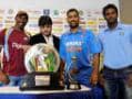 Photo : MS Dhoni, Angelo Mathews and Dwayne Bravo pose with the trophy