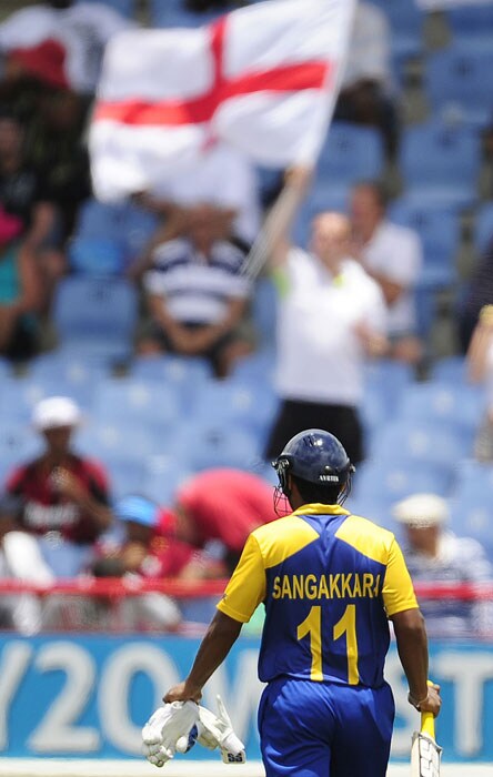 Sri Lankan captain Kumar Sangakkara leaves after being caught out during the ICC World Twenty20 first semifinal match between Sri Lanka and England at the Beausejour Cricket Ground. (AFP Photo) WT20: Eng vs SL