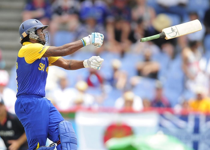 Chamara Kapugedara lets his bat escape from his grip during the ICC World Twenty20 first semifinal match between Sri Lanka and England at the Beausejour Cricket Ground. (AFP Photo) WT20: Eng vs SL