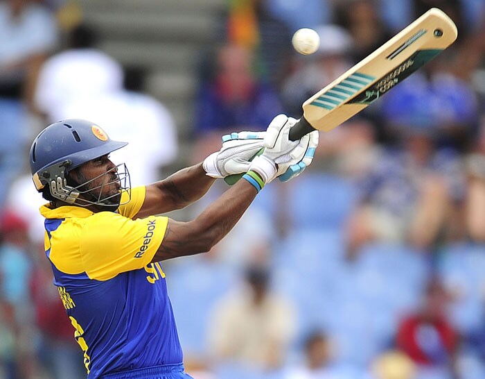 Chamara Kapugedara plays a shot during the ICC World Twenty20 first semifinal match between Sri Lanka and England at the Beausejour Cricket Ground. (AFP Photo) WT20: Eng vs SL