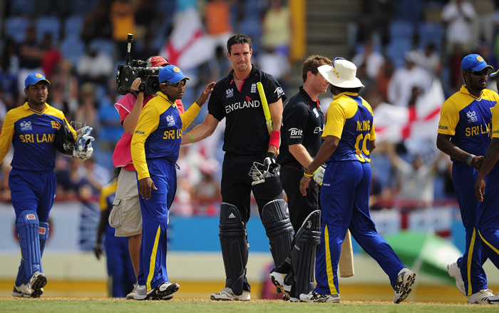Kevin Pietersen congratulates Sri Lankan players at the end of the ICC World Twenty20 first semifinal match between Sri Lanka and England. England won by 7 wickets to qualify for the final. (AFP Photo) WT20: Eng vs SL