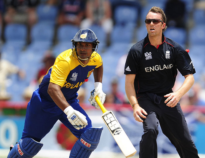 Kumar Sangakkara (L) and English bowler Graeme Swann eyes a high ball to be caught by Kevin Pietersen dismissing Sangakkara during the ICC World Twenty20 first semifinal match. (AFP Photo) WT20: Eng vs SL