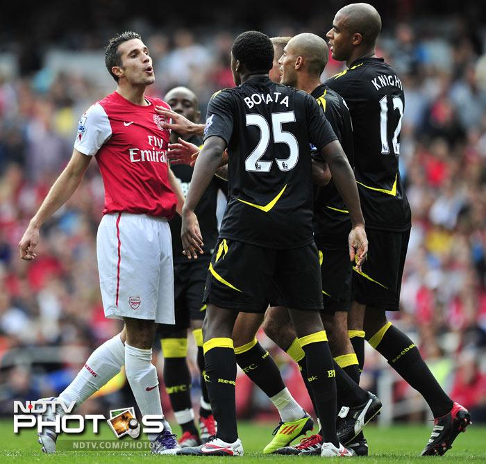 Robin Van Persie, who has been named the captain of the Gunners after the departure of Cesc Fabregas slotted two goals to shrug off Arsenal's problems. (AFP Photo) EPL Match-Week 6