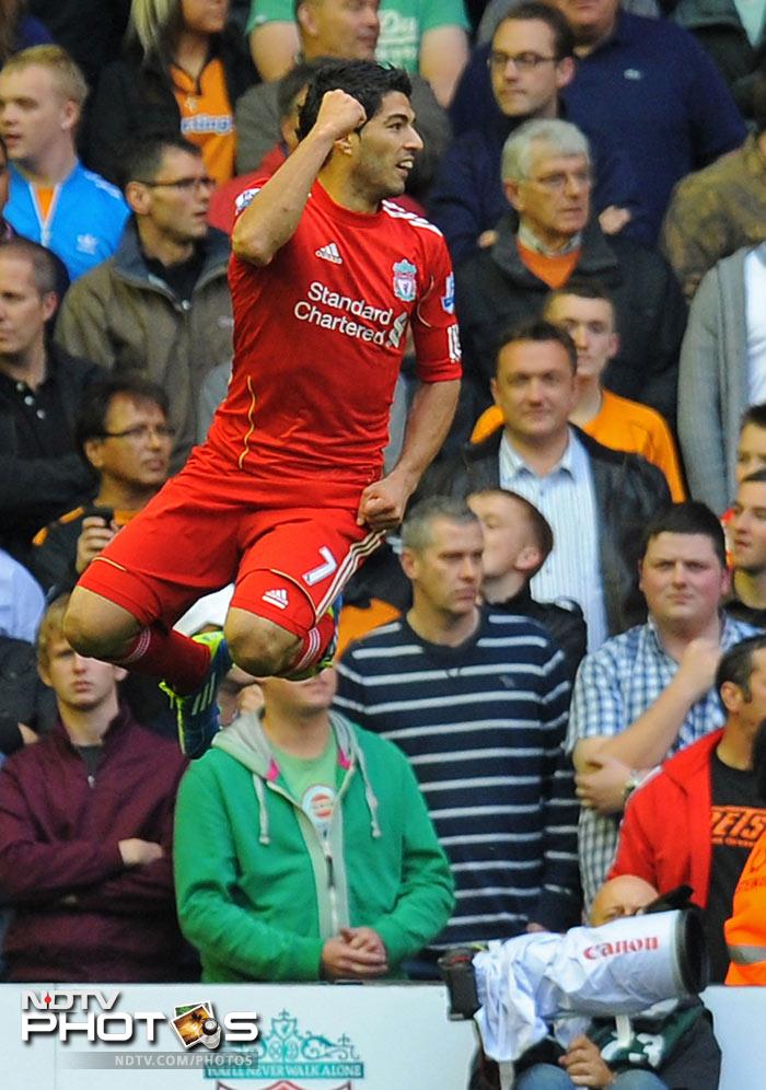 Luis Suarez got on the score-sheet with a brilliant finish at the near post from a tight angle. (AFP Photo) EPL Match-Week 6