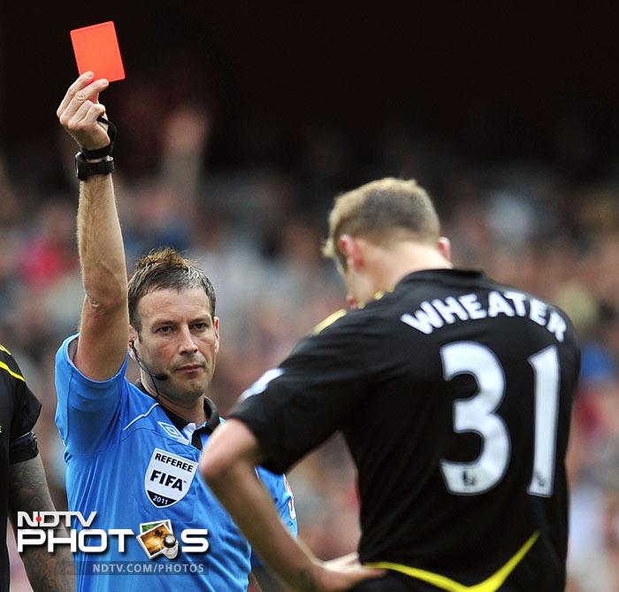 Bolton have had a history of giving Arsenal some concerns but any chances of that happening were wiped out with David Wheater's sending off in the second half. (AFP Photo) EPL Match-Week 6
