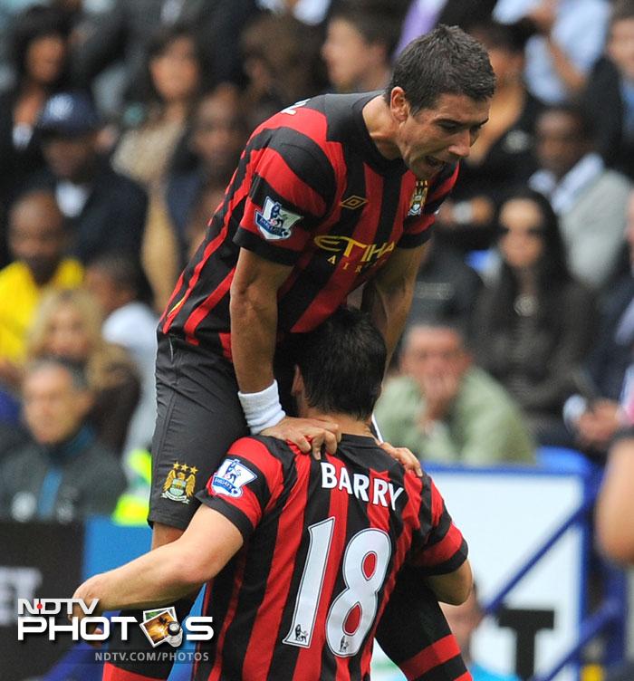 Manchester City enjoy yet another weekend at the top of the table as Liverpool and Chelsea register their first wins. Potential movers were also on the field as the transfer enters into its last week. (AFP Photo) EPL 2011: Match-Week 2