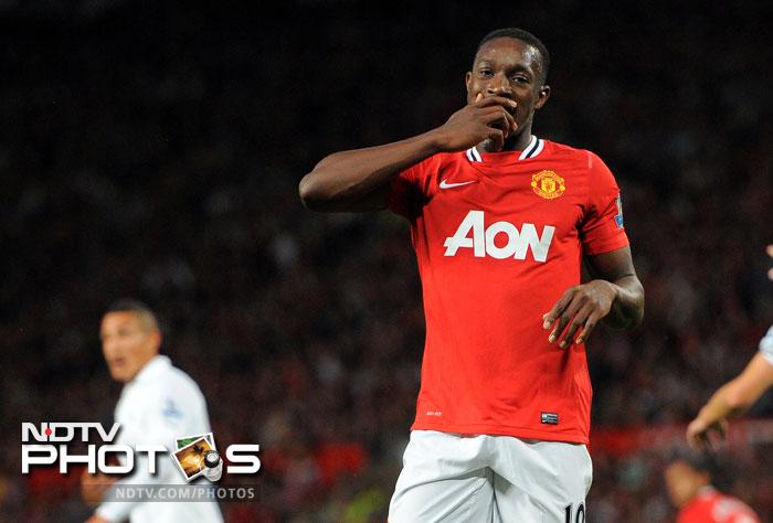 Danny Welbeck opened the scoring with a well placed header off a brilliantly weighted Cleverley cross, while the striker set up the second for Anderson. (AFP Photo) EPL 2011: Match-Week 2