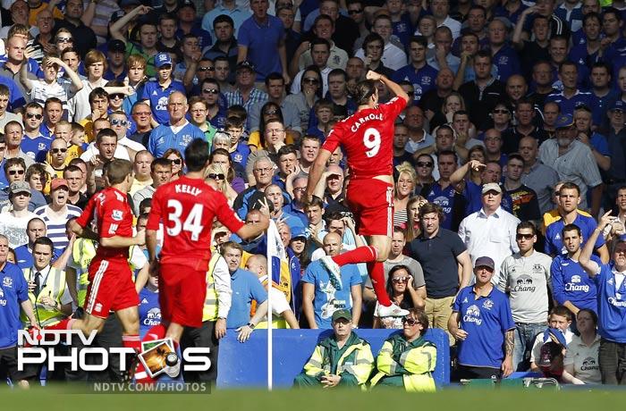 Andy Carroll (C) celebrates scoring his goal during the English Premier League football match between Everton and Liverpool at Goodison Park. EPL 2011: Match-Week 7