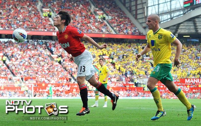 Manchester United made sure that they got the points despite a below par performance against Norwich City at Old Trafford. (AFP Photo) EPL 2011: Match-Week 7