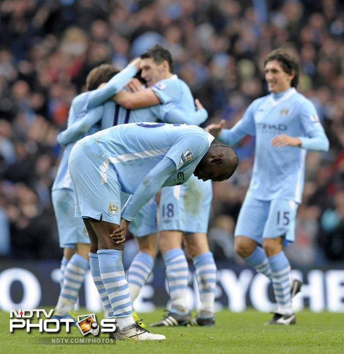 Their second goal came of a rebound from a David Silva shot. City had a scare in the following minutes with Vincent Kompany conceding a penalty and consequently being sent off for the offence. (AFPP Photo) EPL 2011: Match-Week 10
