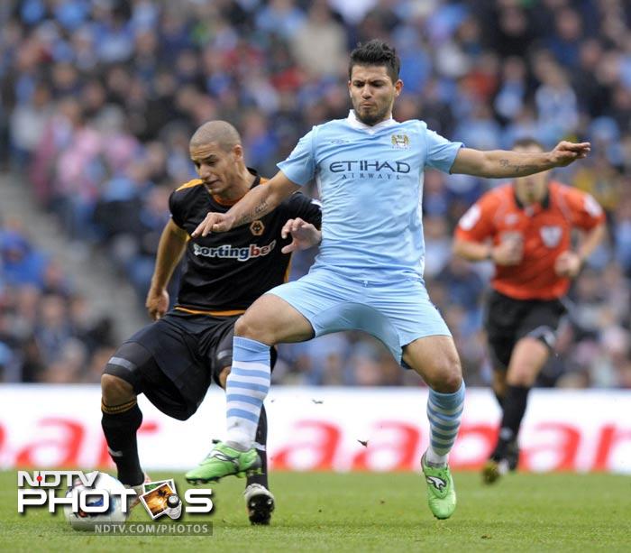Manchester City, meanwhile, extended their stay against a stubborn Wolves side. City were lucky to get their first goal with the goalkeeper making an astonishing error. (AFP Photo) EPL 2011: Match-Week 10