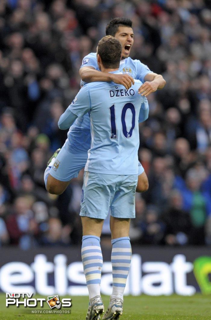 City however, got a third goal to end any doubts and continued to lead the table by 5 points over their local rivals. (AFP Photo) EPL 2011: Match-Week 10