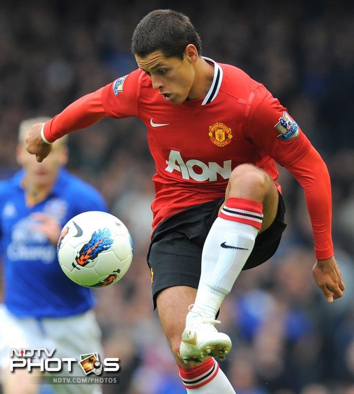It was Javier Hernandez who broke the deadlock, scoring in the 19th minute to give the visitors the lead. (AFP Photo) EPL 2011: Match-Week 10