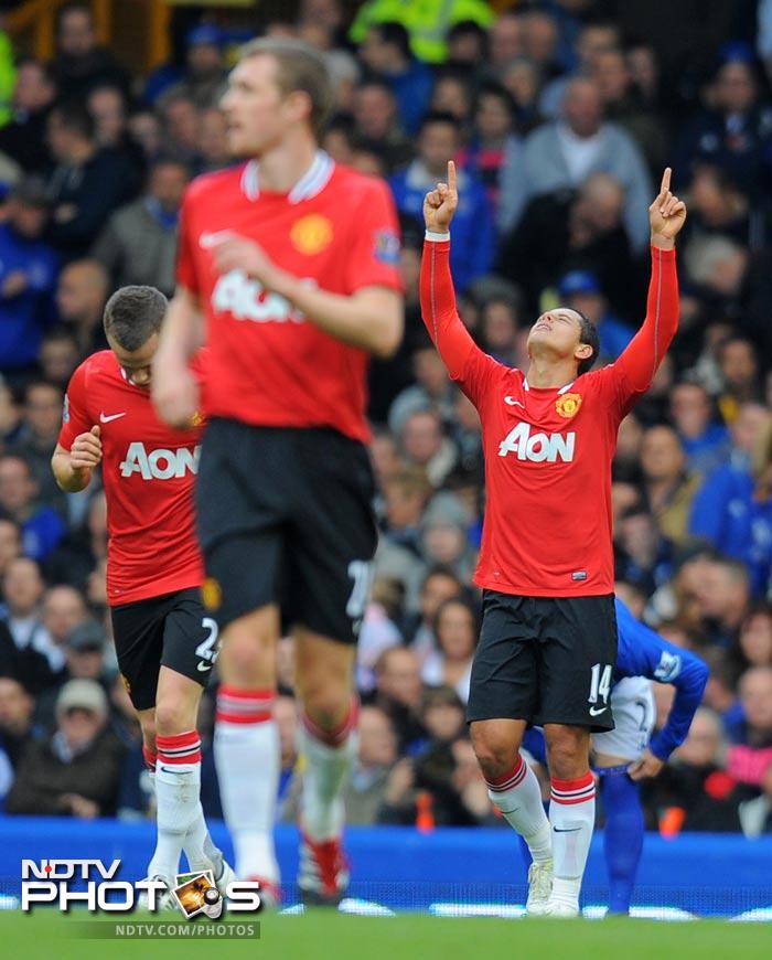 The Mexican turned in an excellently measured Patrice Evra cross from close range. (AFP Photo) EPL 2011: Match-Week 10