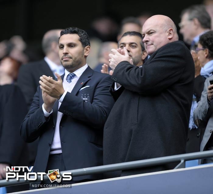 Manchester City's Emirati chairman Khaldoon Al Mubarak (L) looks on during the match. (AFP Photo) EPL 2011: Match-Week 10