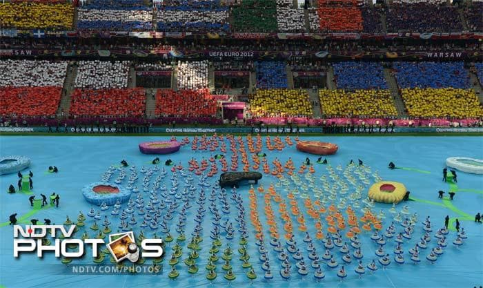 Teams of dancers twirled in formation, as pianist Adam Gyorgy played music from Poland's most favourite son, Frederic Chopin. Euro 2012 gets underway with opening ceremony