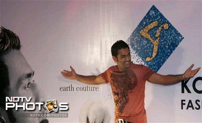 India Skipper MS Dhoni was more than happy to oblige fans as he walked the ramp at the Kolkata Fashion Week in 2009.
