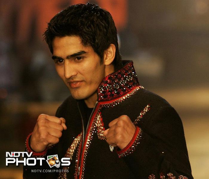 Olympic bronze medallist Vijender Singh displaying that he can crack a punch on the ramp too during the Wills India Fashion Week in 2009.