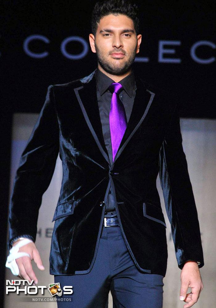 Yuvraj Singh takes a walk down the ramp during the launch of 'The Collective'. He sported a Manish Malhotra creation.