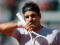 Photo : Roger Federer crashes out to home-favourite Jo-Wilfred Tsonga