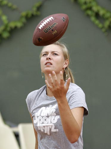 Maria Sharapova, of Russia, plays with a football ball during a training session on Thursday May 22, 2008 at the Roland Garros stadium in Paris. The French Open tennis tournament starts on Sunday. French Open 2008