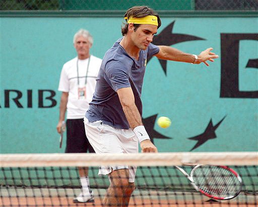 Top-seeded Switzerland's Roger Federer is seen during a training session for the French Open on June 1, 2008 at the Roland Garros stadium in Paris. Behind is Federer's coach, Jose Higueras. (AP Photo) French Open 2008, Day 8