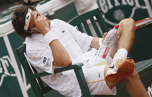 Jeremy Chardy reacts during a break as he plays Spain's Nicolas Almagro during their fourth round match at the French Open in Paris on June 1, 2008. (AP Photo) French Open 2008, Day 8