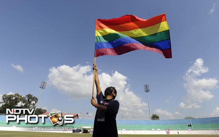 A participant holds a rainbow flag during the opening ceremony of the first South Asia Lesbian, Gay, Bisexual and Transgender (LGBT) Sports Festival in Kathmandu.