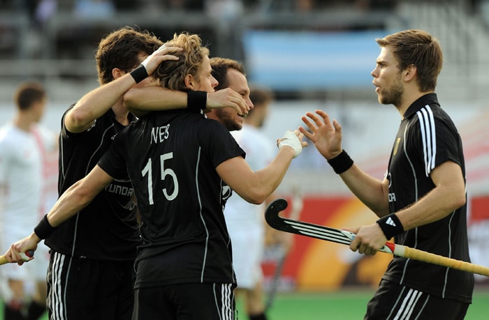 German hockey player Benjamin Wess (2L) celebrates a goal with teammates during their World Cup 2010 match against Canada at The Major Dhyan Chand Stadium in New Delhi. (AFP Photo) Germany rout Canada