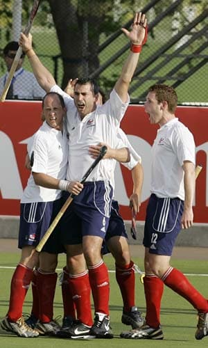 Great Britain's Richard Mantell (centre) celebrates with team-mates after scoring against India in the final game of hockey Olympic qualifiers in Santiago on Sunday. India lose hockey qualifier
