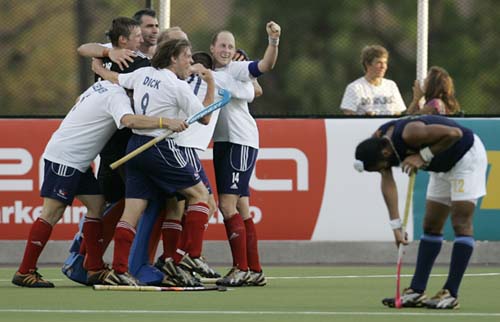 Great Britain's players celebrate their 2-0 victory over India with team-mates after scoring against India in the final game of hockey Olympic qualifiers in Santiago on Sunday. India lose hockey qualifier