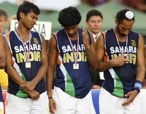 India's players (from left) Dilip Tirkey, V.R. Raghunath and Rajpal Singh wear their medals after losing to England the field hockey final qualifying match for the Beijing 2008 Olympic Games in Santiago on Sunday. India lose hockey qualifier