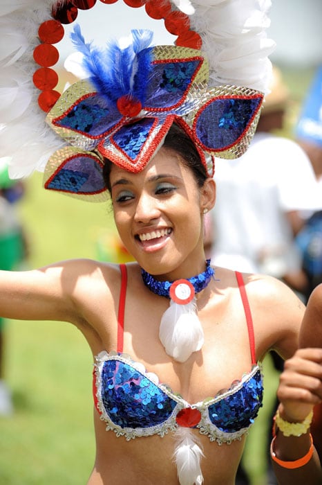 An artist jives while singing along with reggae singer Shaggy before the opening match of the ICC World Twenty20 tournament at the Providence Stadium. (AFP Photo) ICC WT20 opening ceremony