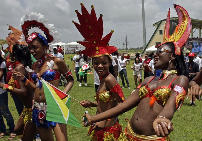 Entertainers, dressed in carnival costumes, dance to the music of Jamaican reggae artist Shaggy, unseen, prior to the match between New Zealand and Sri Lanka in the Twenty20 match in Georgetown. (AP Photo) ICC WT20 opening ceremony