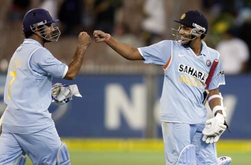 Indian captain MS Dohni, left, congratulates his teammate Rohit Sharma after defeating Australia in their one-day international cricket match at the Melbourne Cricket Ground on Sunday, February 10, 2008. 4th Match: India vs Australia