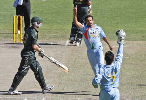 Irfan Pathan, center, and MS Dhoni celebrate the wicket of Brett Lee, left, from Australia during their one-day international cricket match at the Melbourne Cricket Ground on Sunday, February 10, 2008. 4th Match: India vs Australia