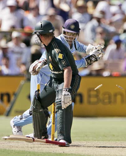 James Hopes, left, drops his bat as he turns to see he is stumped by Mahendra Dhoni in their one-day international cricket match at the Adelaide Oval on Sunday, February 17, 2008. 7th Match: India vs Australia