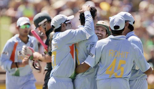 Indian team mates congratulate Irfan Pathan, 4th right, after he took the wicket of Matthew Hayden, second left, for 13 runs in their one-day international cricket match at the Adelaide Oval on Sunday February 17, 2008. 7th Match: India vs Australia