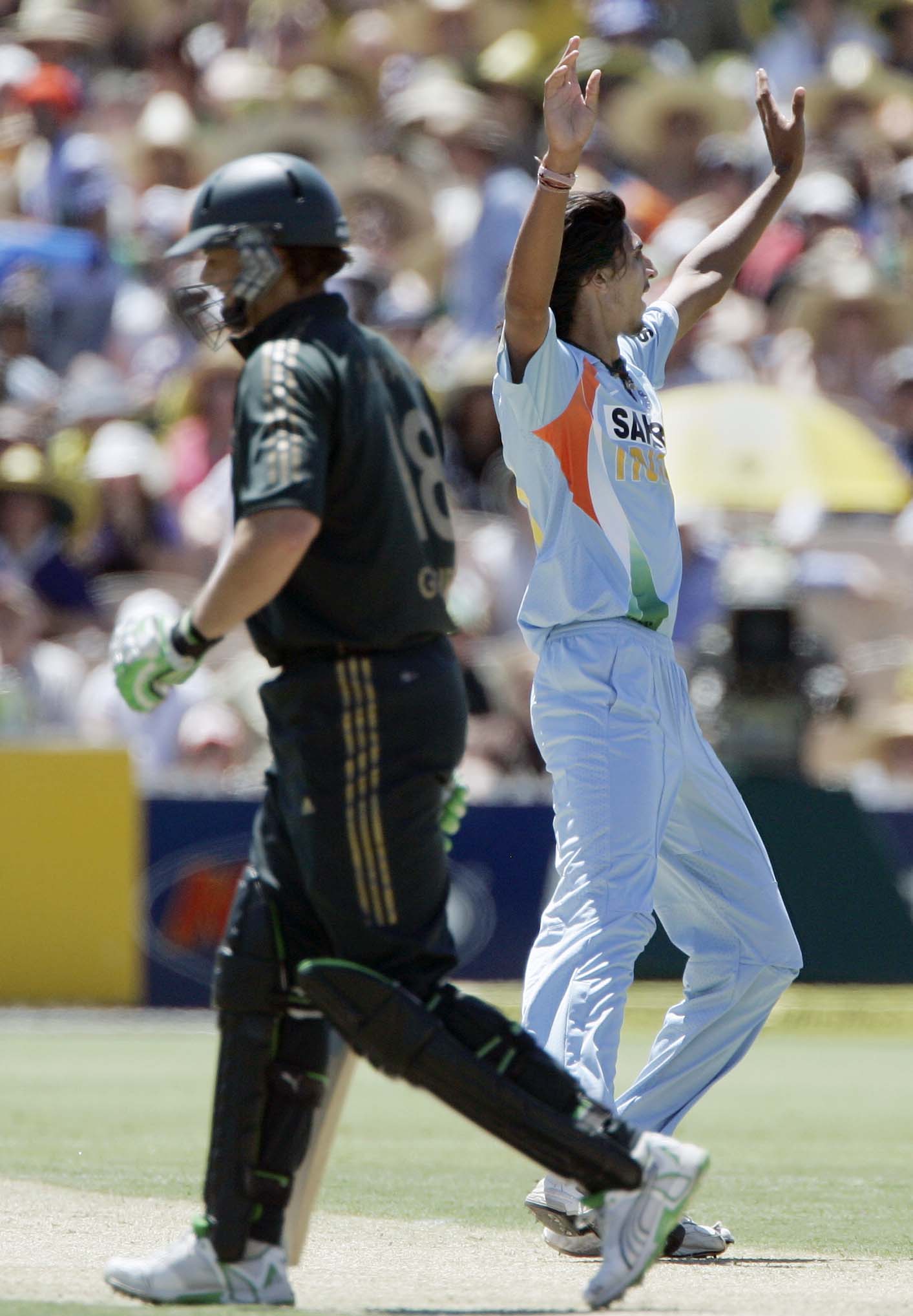 Ishant Sharma, right, celebrates bowling out Adam Gilchrist, left, for 15 runs in their one-day international cricket match at the Adelaide Oval on Sunday, February 17, 2008. 7th Match: India vs Australia