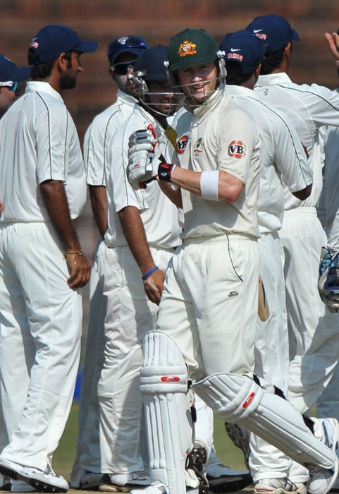 Indian cricketers celebrate the wicket of Michael Clarke during the second day of the three-day practice match between Australia and the Indian Board President's XI in Chandigarh. (AFP Photo) Australia vs Board President's XI