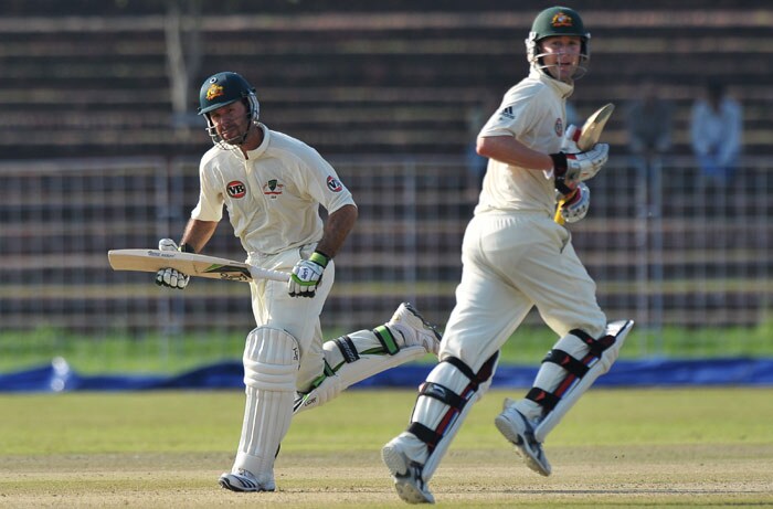 Ricky Ponting and Michael Clarke run between wickets during the first day of the three-day practice match against the Indian Board President's XI in Chandigarh. (AFP Photo) Australia vs Board President's XI