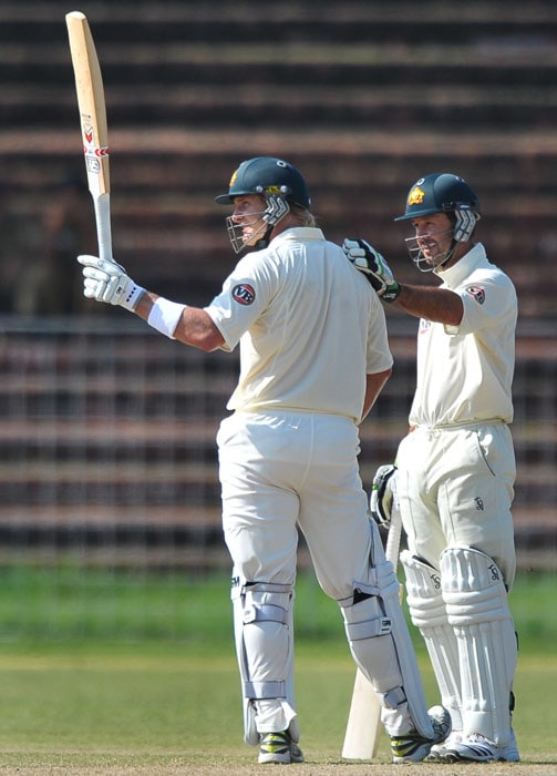 Ricky Ponting congratulates teammate Shane Watson for scoring a century during the first day of the three-day practice match against the Indian Board President's XI in Chandigarh. (AFP Photo Australia vs Board President's XI