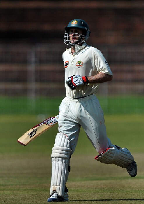 Simon Katich completes a run to make his century (100 runs) during the first day of the three-day practice match against the Indian Board President's XI in Chandigarh. (AFP Photo) Australia vs Board President's XI