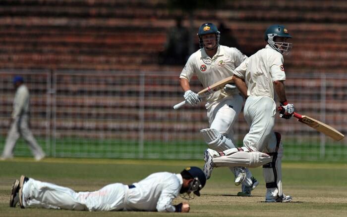 Shane Watson and Simon Katich run between wickets during the first day of the three-day practice match against the Indian Board President's XI in Chandigarh. (AFP Photo) Australia vs Board President's XI