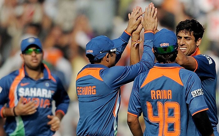 India's Ashish Nehra celebrates with teammates after taking the wicket of Australia's Shaun Marsh during the fourth ODI match at Mohali on Tuesday. (AFP Photo) Australia bounce back against India