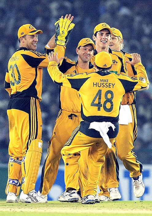 Australians celebrate the dismissal of India's Ravindra Jadeja during the fourth ODI match at Mohali on Tuesday. (AFP Photo) Australia bounce back against India